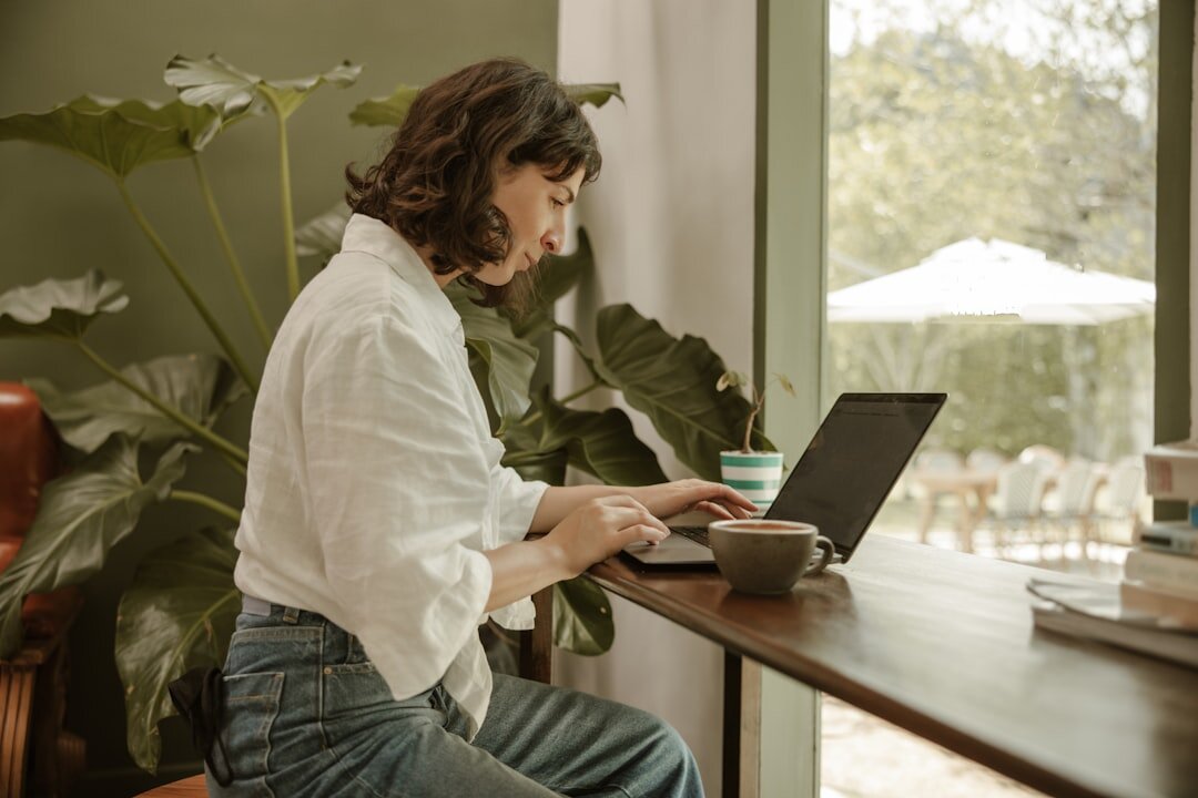 Person studying an online course on a laptop at a desk