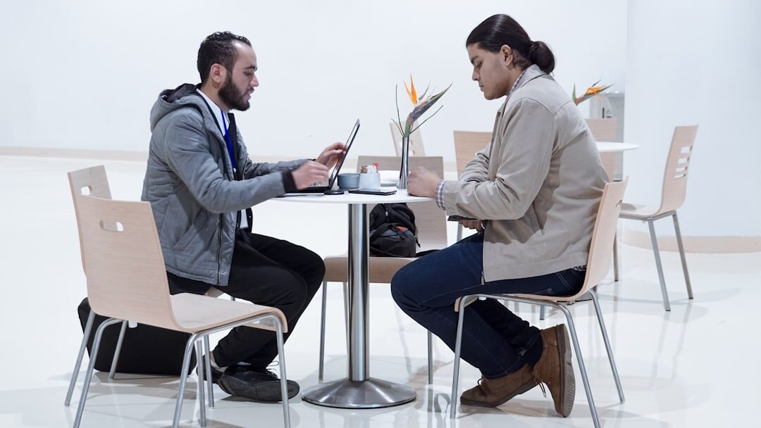 Two professionals in a formal business interview setting