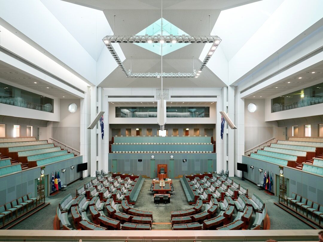 Person speaking at a podium in a large auditorium